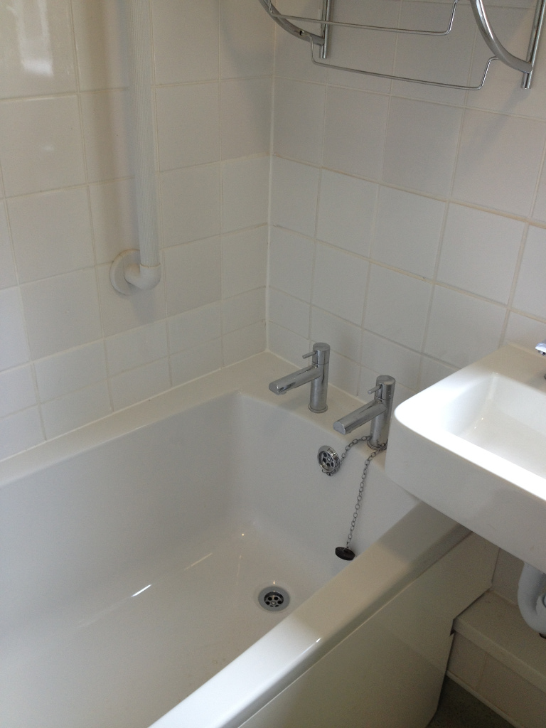 bathtub with separate hot and cold water taps