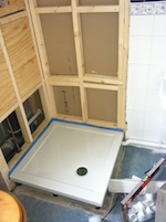 partial shower cubicle with the wood framing and shower tray